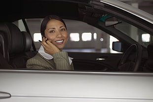 woman sitting inside white car HD wallpaper