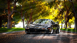 black ACURA NSX 1st gen. coupe parked near trees during daytime
