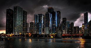 wide angle photo of concrete high-rise buildings near body of water HD wallpaper