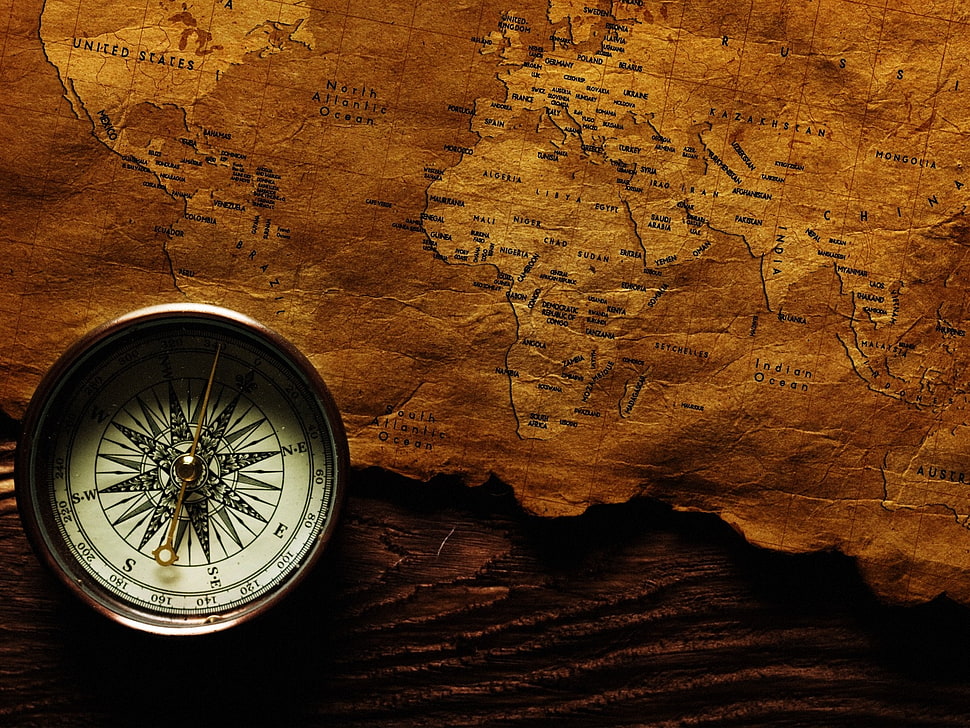 white compass with brown map HD wallpaper