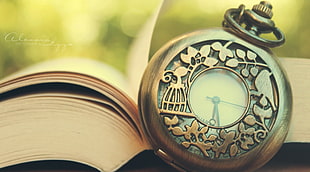 silver-colored pocket watch, watch, books