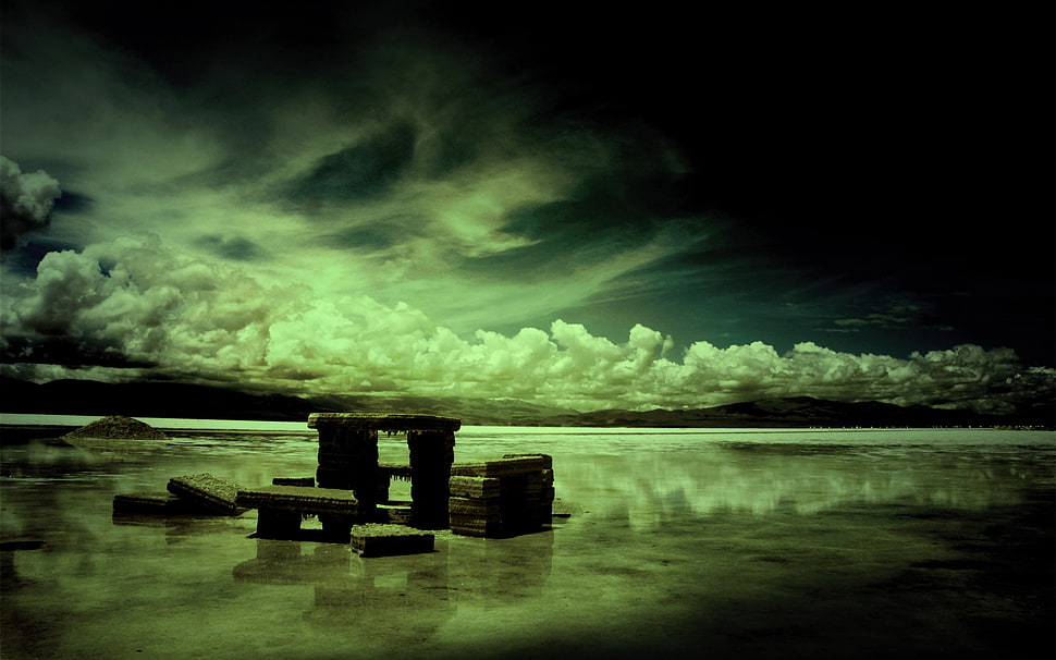 stone fragments under cloudy sky HD wallpaper