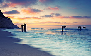 pillars on shore, sunset, sea, nature, sky