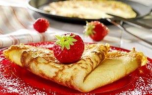 depth of field photo of pancake with strawberry