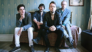 band photo on sofa
