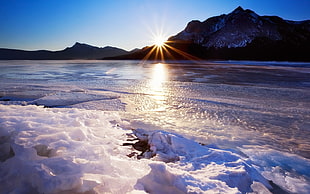 sunrise on snowy seashore