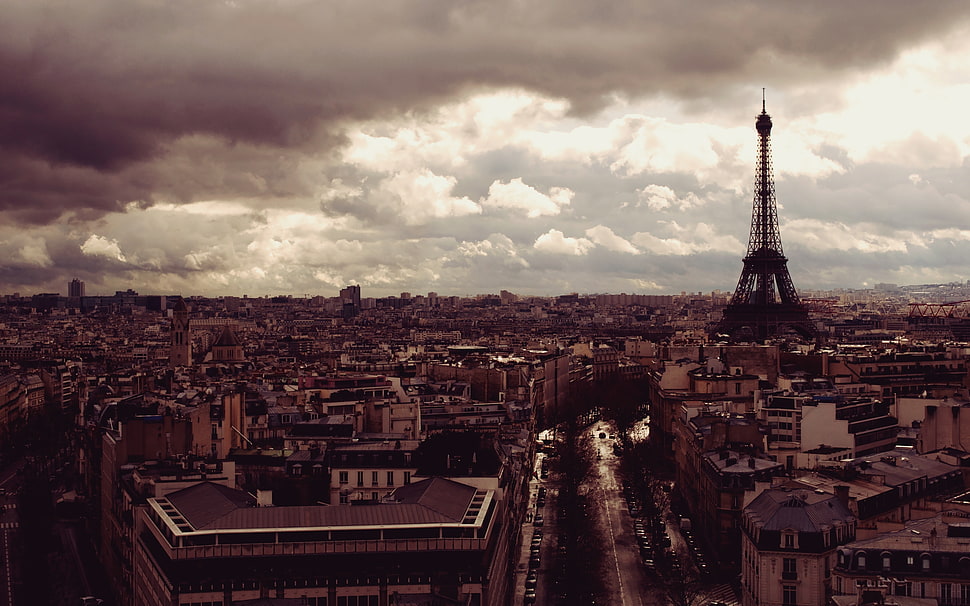 Eiffel Tower under white clouds during daytime HD wallpaper