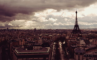 Eiffel Tower under white clouds during daytime
