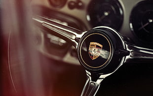 selective focus photography of Lamborghini steering wheel