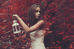 woman wearing white dress holding white candle lantern HD wallpaper