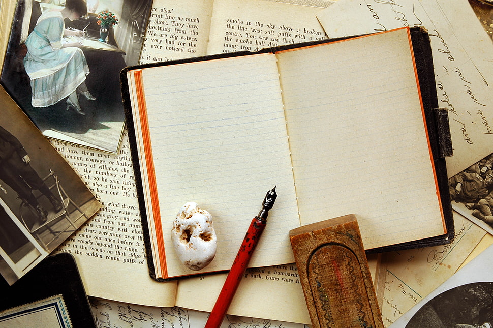 red fountain pen on white book HD wallpaper