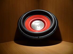 close up photo of black and red speaker
