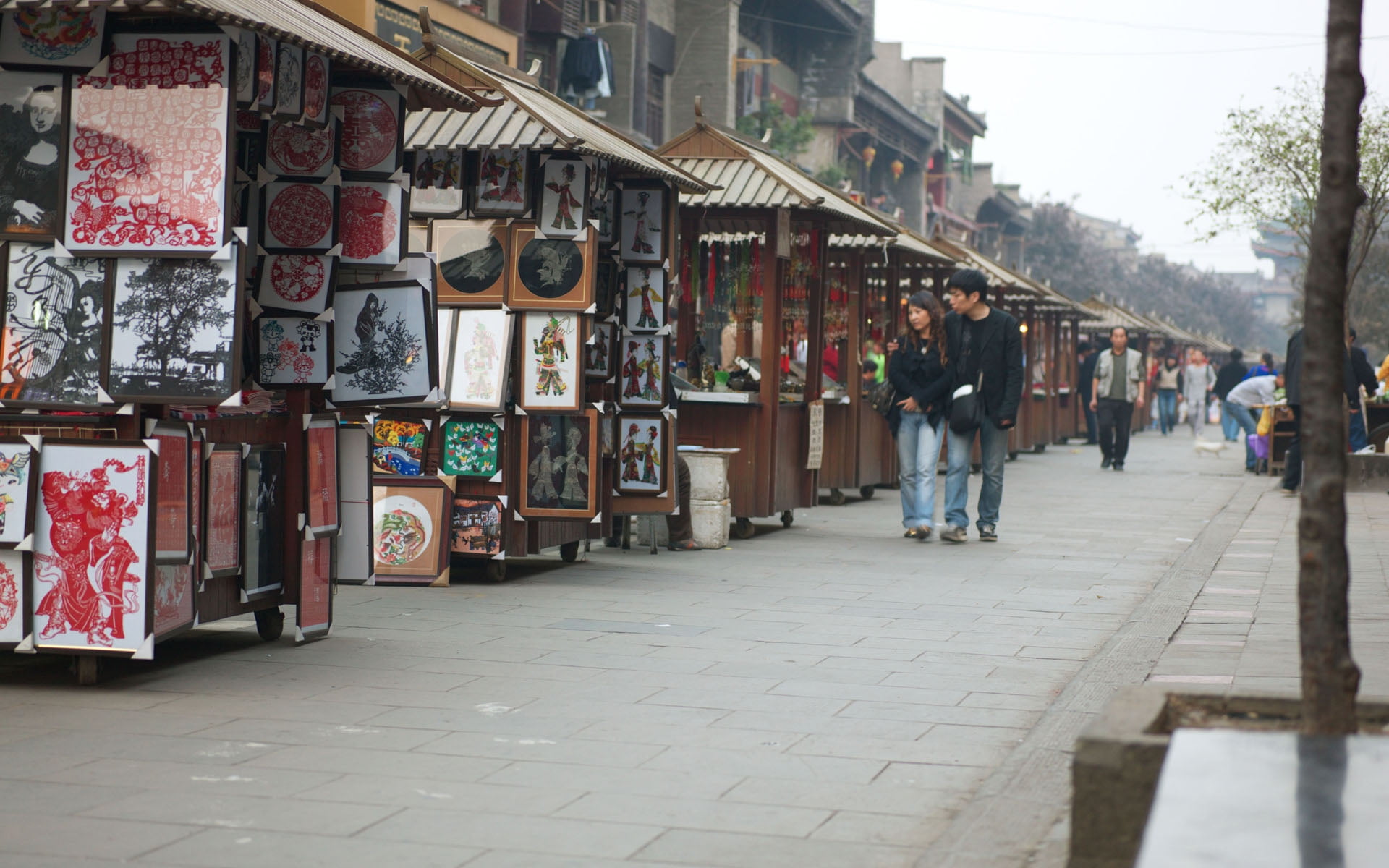 couple walking down the market area