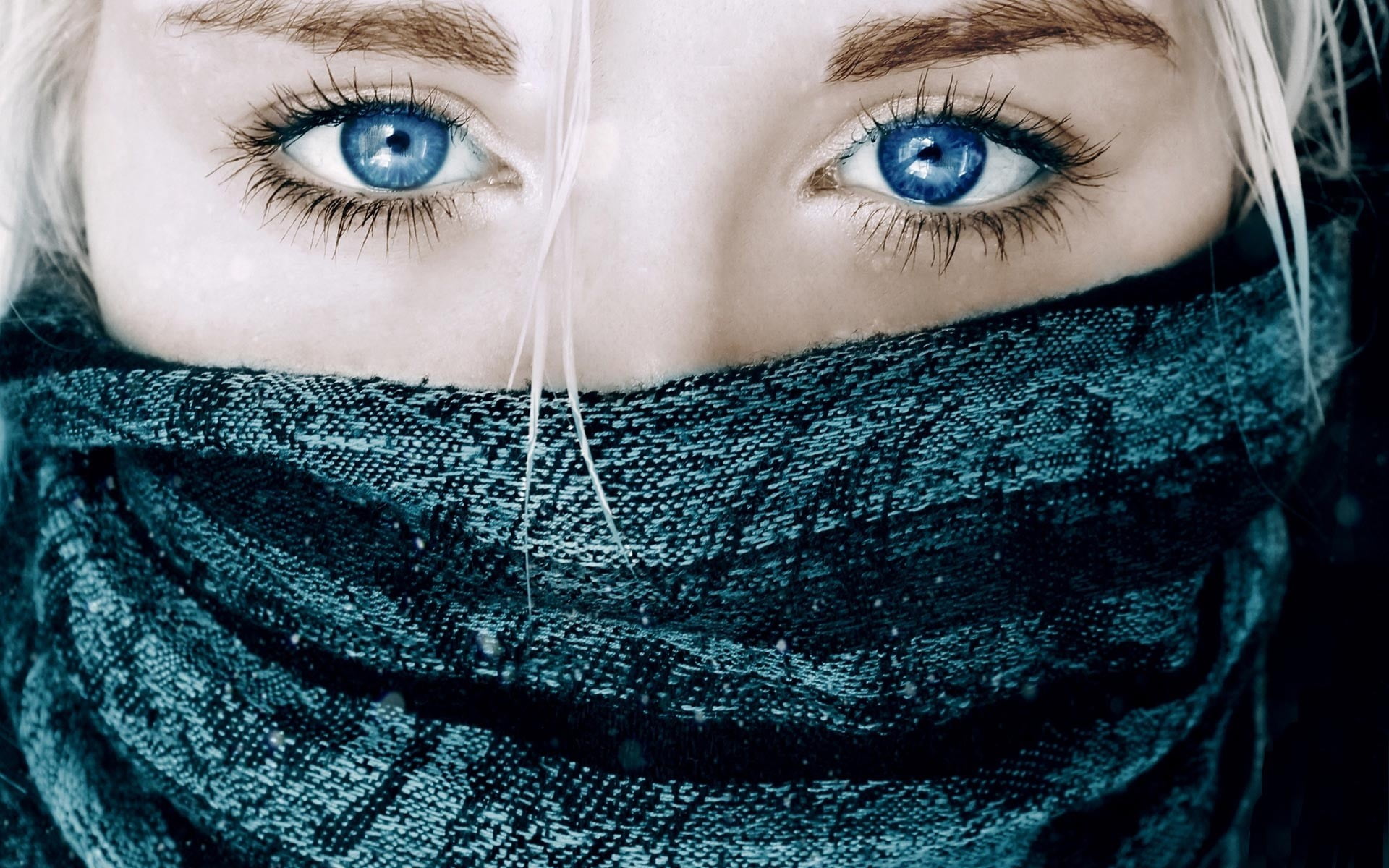 woman with blue eyes taking selfie