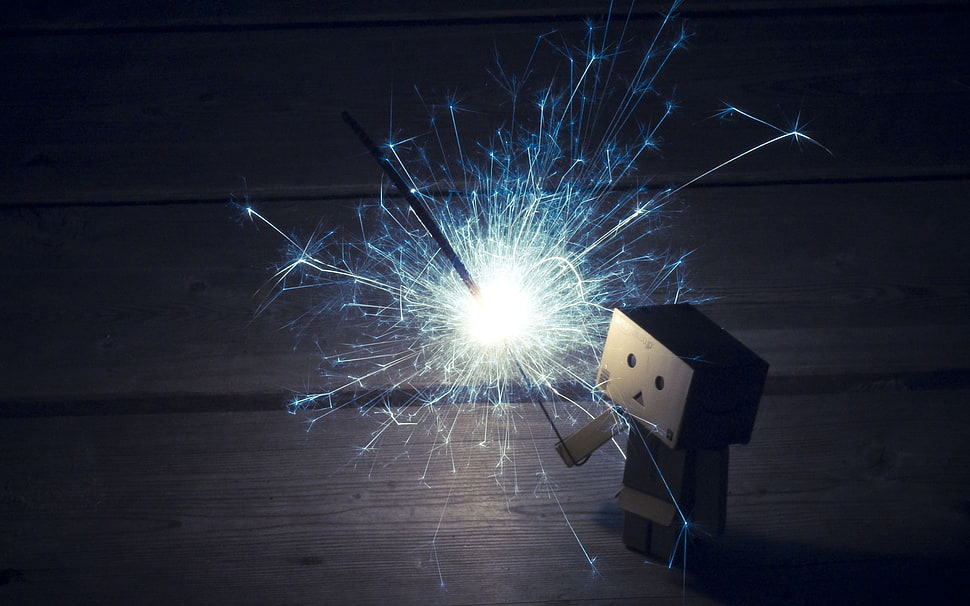 carton box man holding fire stick cracker HD wallpaper