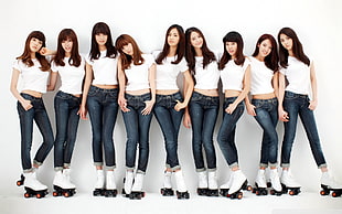 group of women in white crop top and jeans