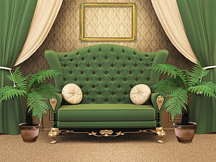 tufted green couch with two round throw pillows
