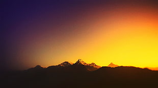 silhouette of mountain range during golden hour HD wallpaper