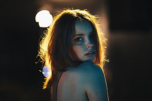 shallow focus photography of topless woman