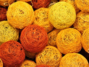 yellow and red rattan balls
