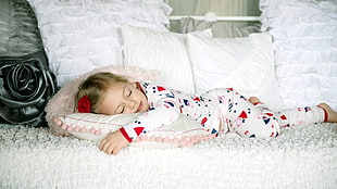 girl wearing pajamas sleeping on white bed HD wallpaper