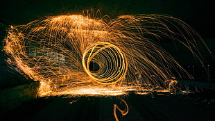 timelapse photography of round yellow sparks