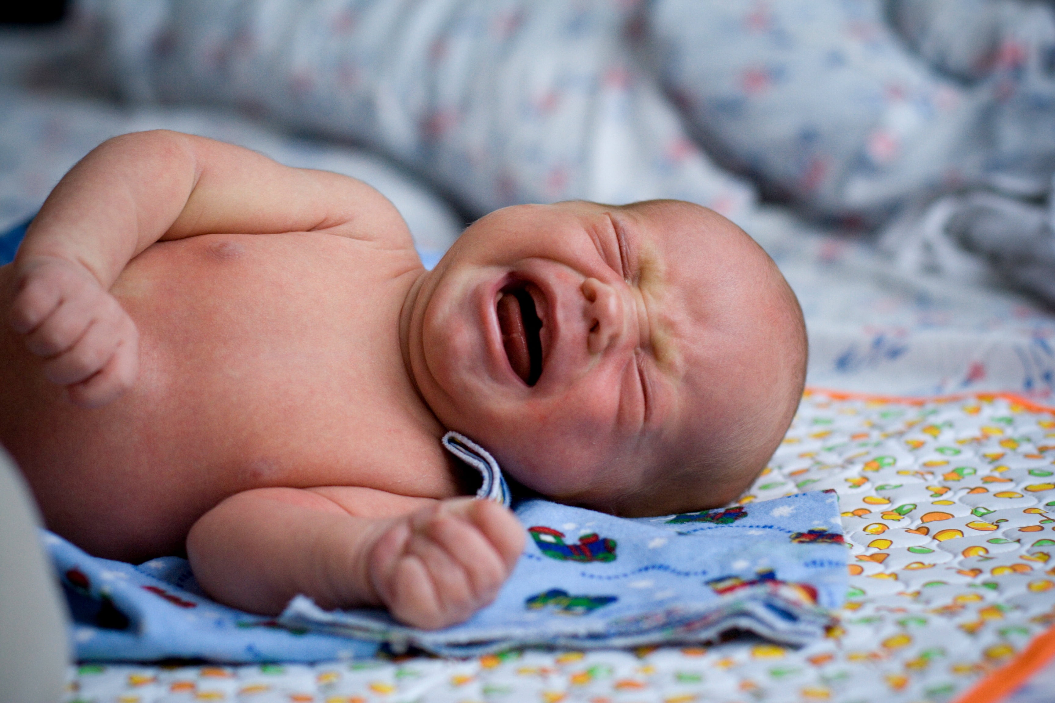 baby crying while lying down