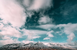 landscape photography of snowy mountains with clouds