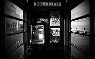 photography of grayscale payphone