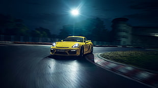 yellow sports car on blacktop road at nighttime HD wallpaper