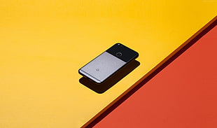 smartphone on yellow surface