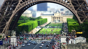 focused photo of people near Eiffel tower