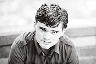 man in collared top grayscale photo