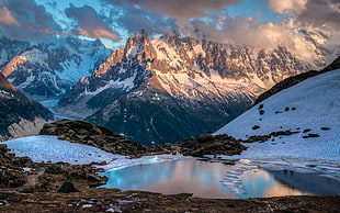 landscape photography of body of water near mountain HD wallpaper