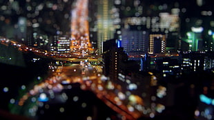 tilt photo of buildings taken during night time