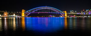 bridge with lights during night time HD wallpaper