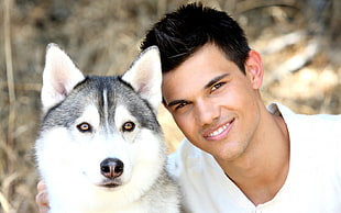 Taylor Lautner with adult silver Siberian Husky