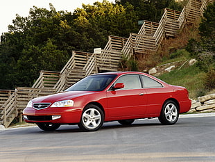 photography of red Acura RL coupe
