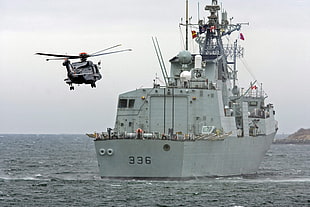 helicopter flying near ship