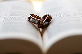 two silver rings in book