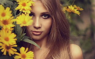woman with yellow flowers photo