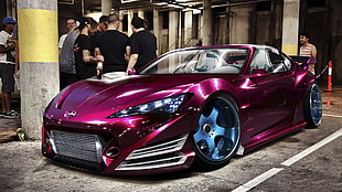 purple Scion FRS surrounded by people
