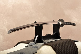 silver katana on brown wooden rack HD wallpaper