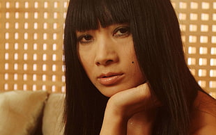 woman with black straight hair with bangs