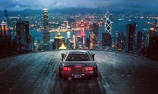 black car parked on top of building with cityscape view HD wallpaper
