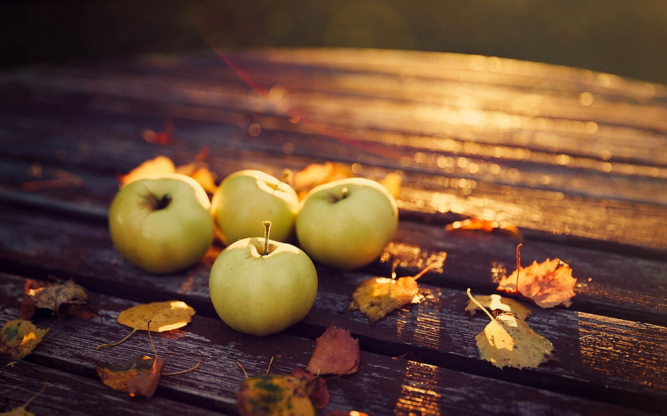 four green apples, fruit, macro, table, leaves HD wallpaper
