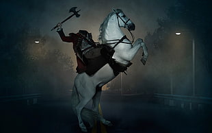 headless man riding in horse photo