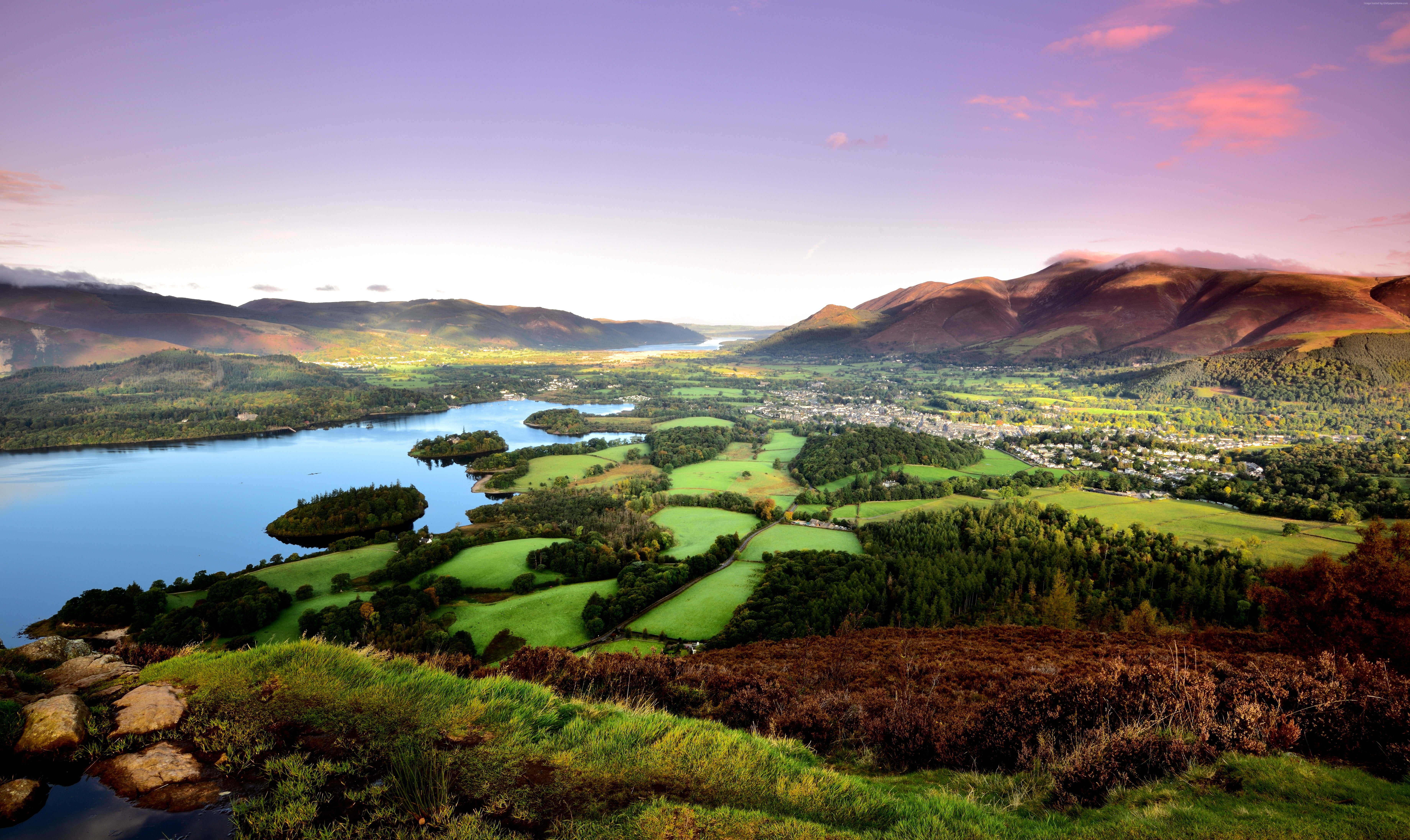 aerial photography of mountains and body of water