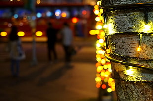 yellow and red beaded necklace, trees, city, bokeh, christmas lights