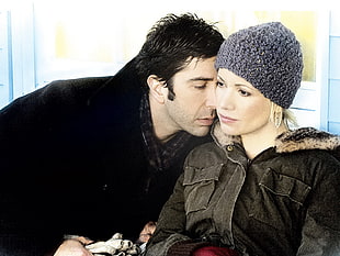 man in black coat beside woman in gray coat HD wallpaper
